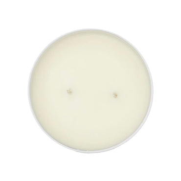 Round white candle on a white background