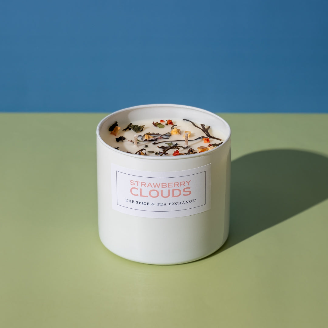 Strawberry Clouds Candle View 4 on green and blue background