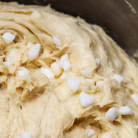 Close-up of cookie dough with white chocolate chips