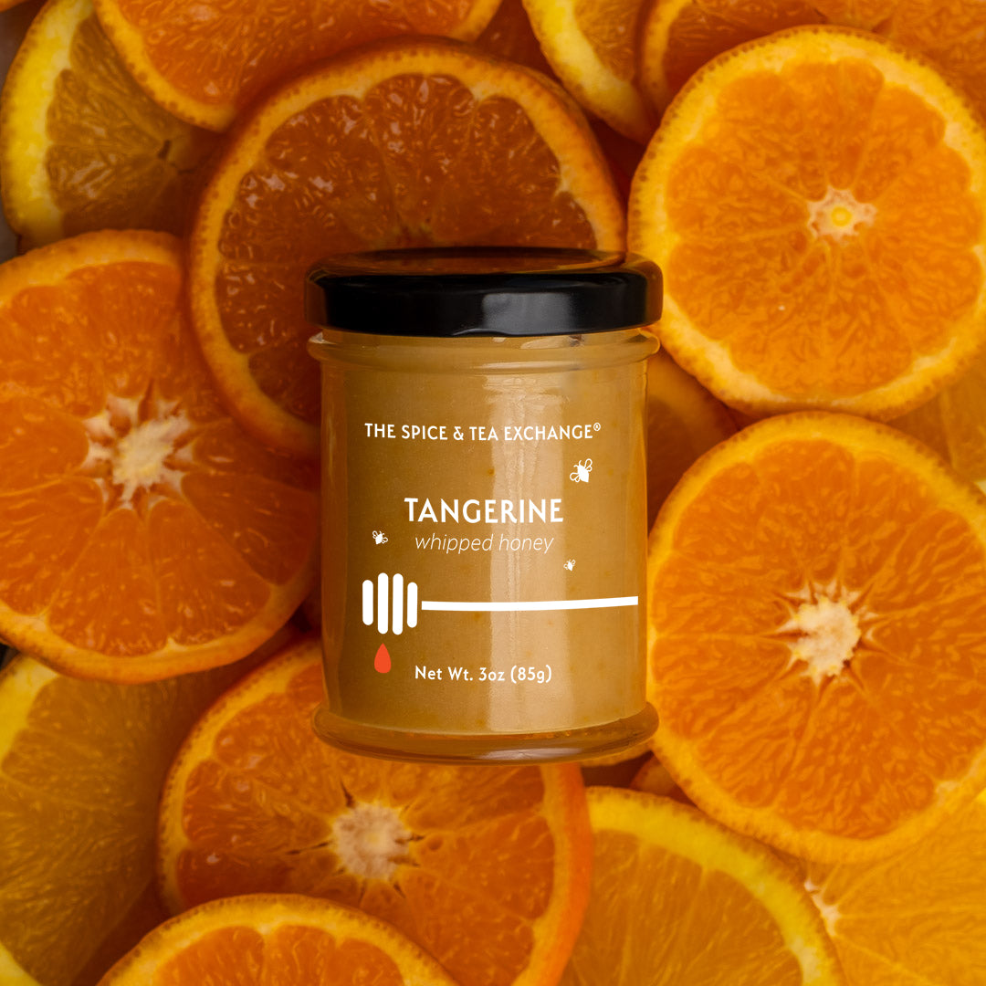 Tangerine Whipped Honey - on background of tangerine slices