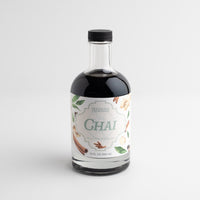Bottle of Chai tea concentrate with a label on a white background