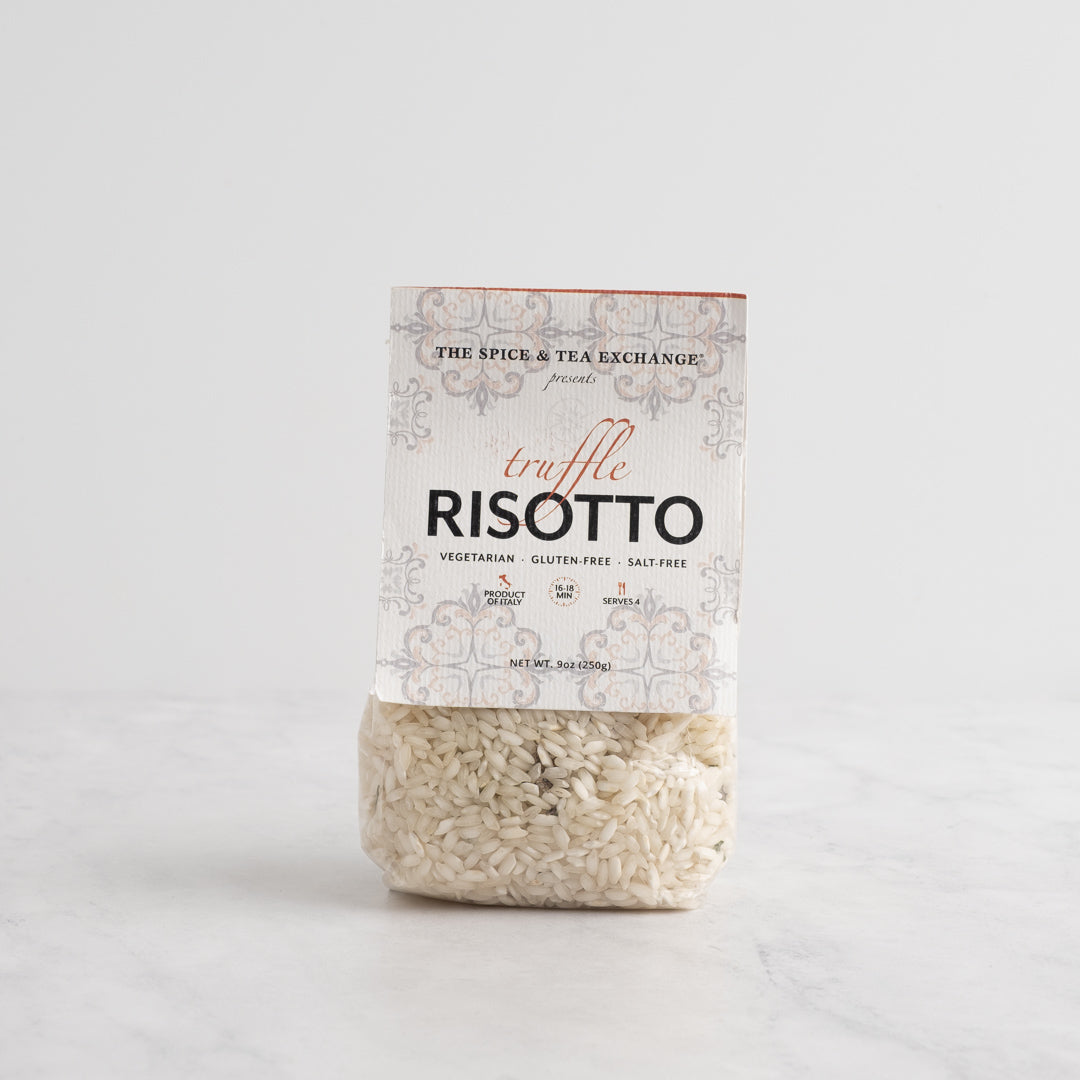 A package of Truffle Risotto rice from The Spice & Tea Exchange, featuring a white paper label with elegant gray patterns and a clear lower section showing the risotto grains inside, set against a clean white background.