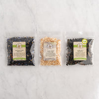 Very Vanilla Sampler contents laid out on white marble background
