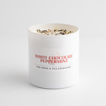 White chocolate peppermint candle in a white container with visible text on a white background