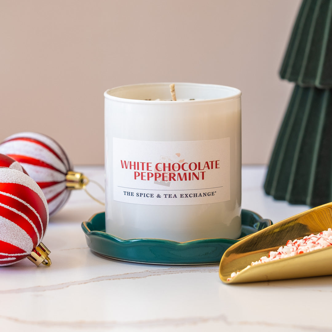 White chocolate peppermint candle with decorative elements on a table