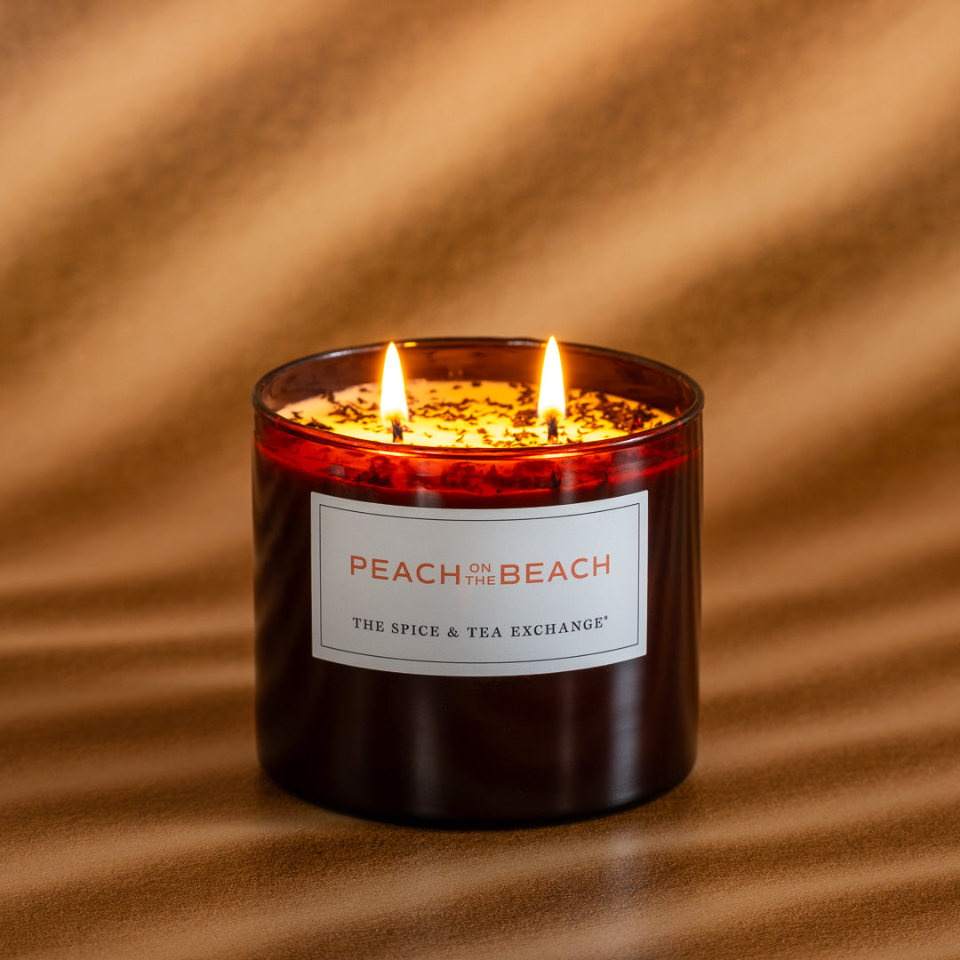 Peach on the Beach candle lit on brown background