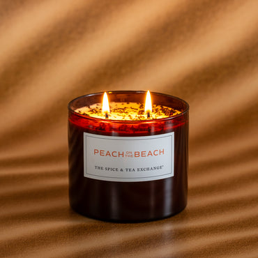 Peach on the Beach candle lit on brown background